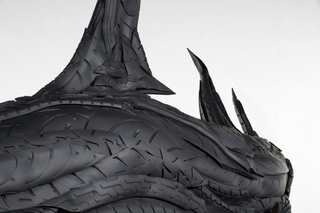 Illustration for article titled This Artist Turns Old Tires Into Dark, Disturbing Nightmare Monsters